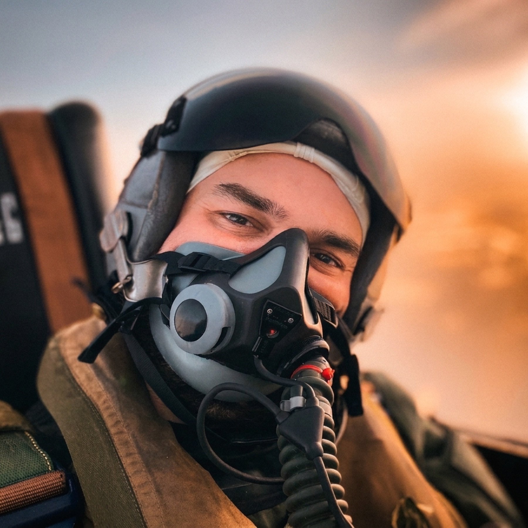 Cockpit portrait of Alejandro Gutiérrez Mourente, oxygen mask on, level flight